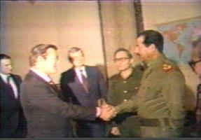 Com Saddam Hussein.